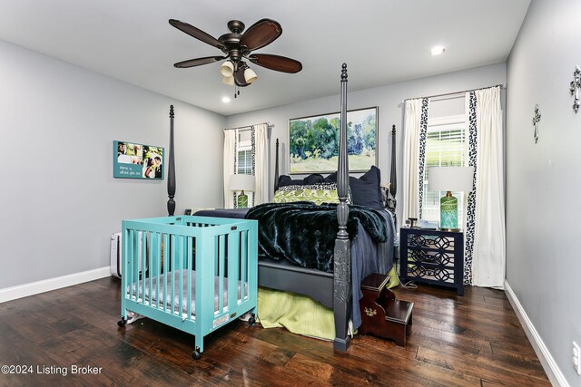 bedroom with ceiling fan and dark hardwood / wood-style flooring