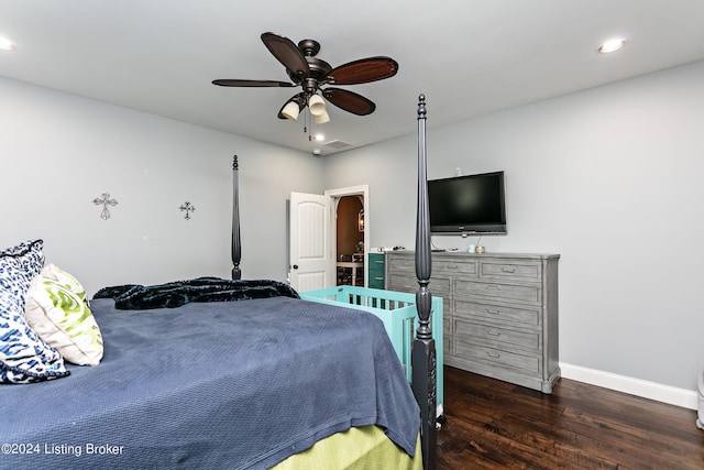 bedroom with ceiling fan and dark wood-type flooring