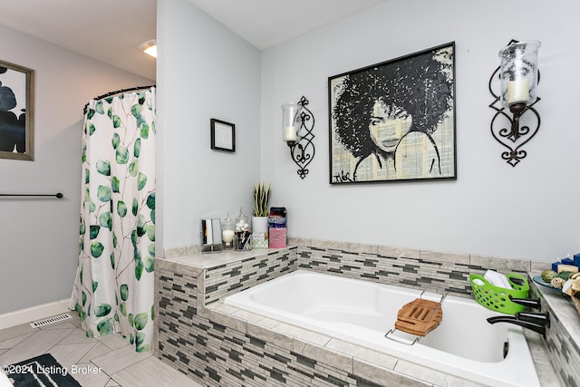 bathroom featuring shower with separate bathtub and tile patterned floors