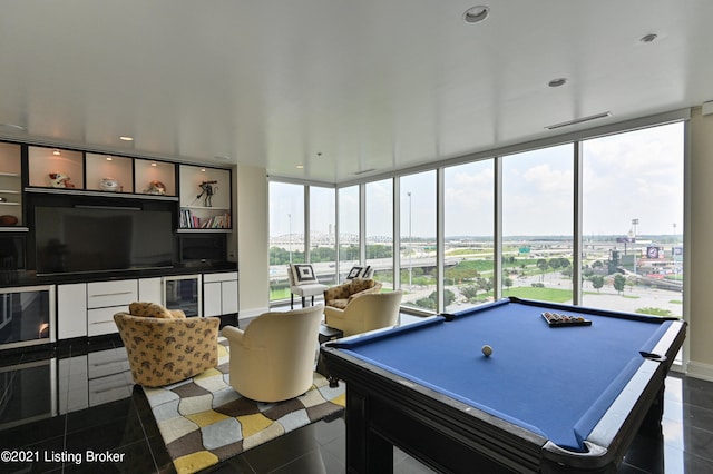 recreation room featuring pool table, beverage cooler, and dark tile patterned floors