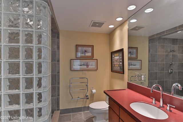 bathroom with visible vents, toilet, tile patterned flooring, and a walk in shower