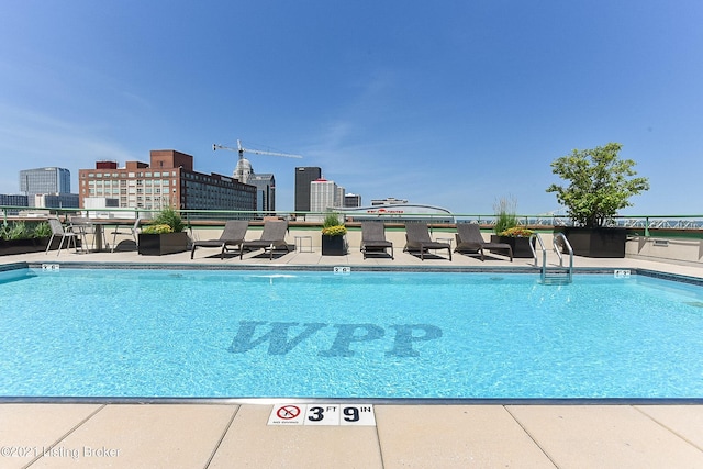 community pool featuring a view of city