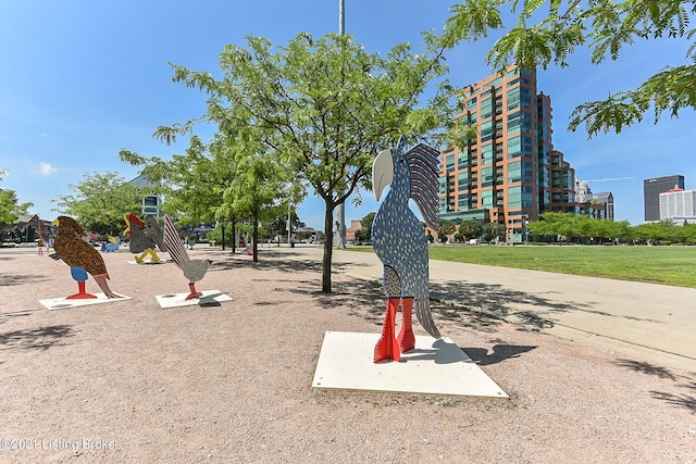 view of property's community featuring a yard