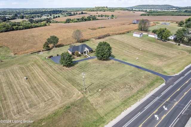 birds eye view of property with a rural view