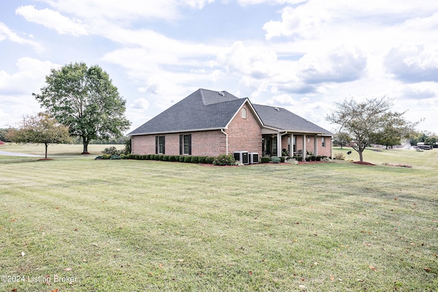 view of side of home featuring a lawn