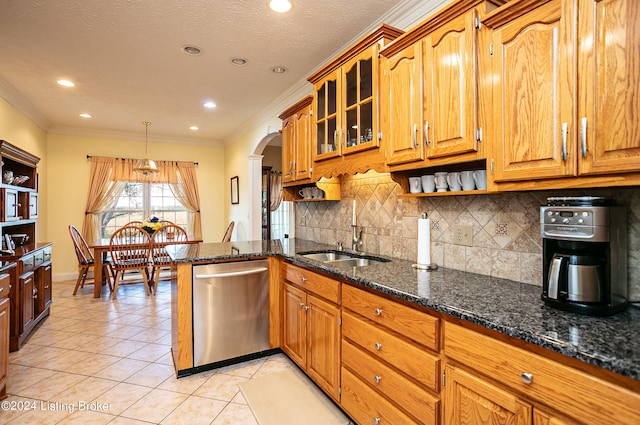 kitchen with dishwasher, light tile patterned flooring, sink, decorative light fixtures, and ornamental molding