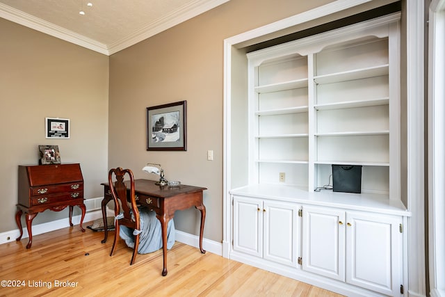 office with light wood-type flooring, crown molding, and a textured ceiling