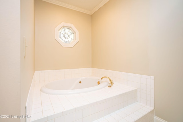 bathroom featuring ornamental molding and a relaxing tiled tub