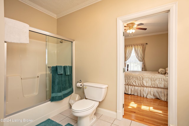 bathroom with ceiling fan, toilet, crown molding, and tile patterned flooring