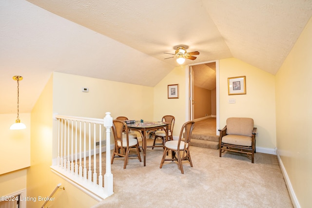 sitting room featuring vaulted ceiling, ceiling fan, and carpet flooring