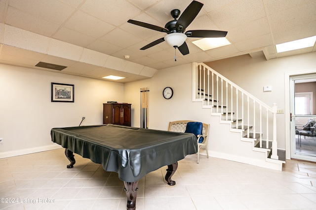 game room with ceiling fan, light tile patterned flooring, a drop ceiling, and pool table