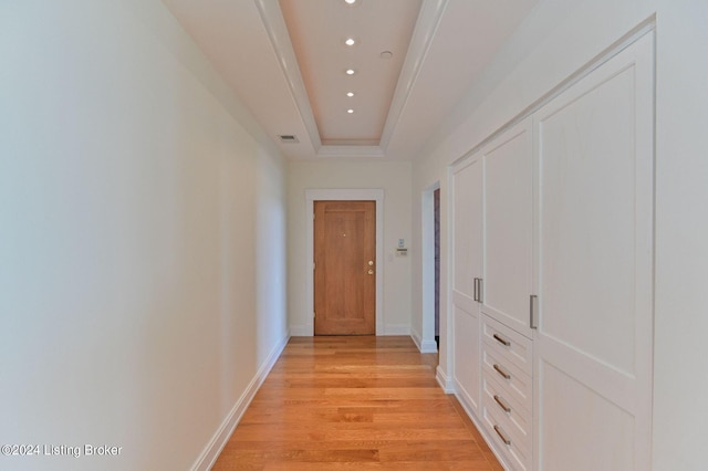 222 E Witherspoon St Unit 703-704, Louisville, KY 40202 - hall featuring a tray ceiling, baseboards, visible vents, light wood-style floors, and recessed lighting