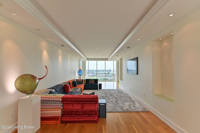 living room featuring expansive windows and light wood-type flooring