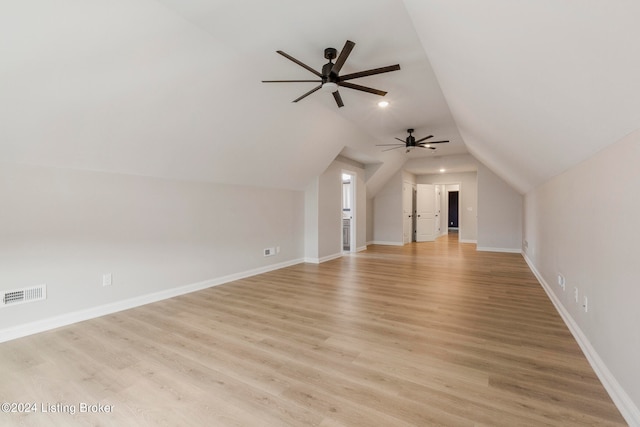 bonus room with light hardwood / wood-style floors, lofted ceiling, and ceiling fan