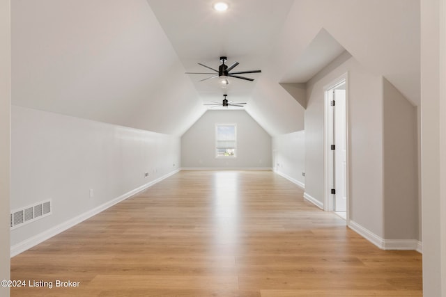 bonus room with ceiling fan, light hardwood / wood-style flooring, and lofted ceiling