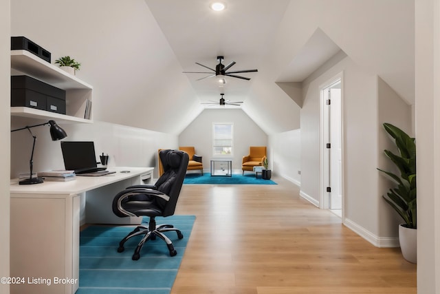 home office featuring ceiling fan, vaulted ceiling, and light hardwood / wood-style floors