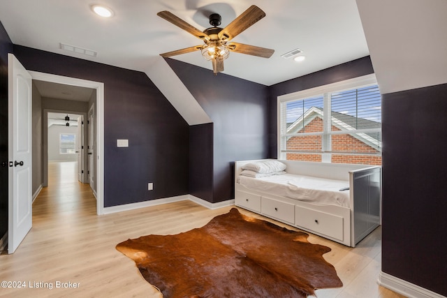 bedroom with light wood-type flooring and ceiling fan