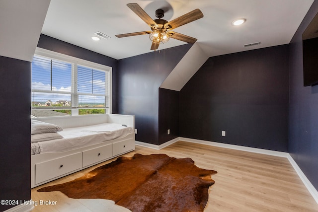 bedroom with ceiling fan and light hardwood / wood-style flooring