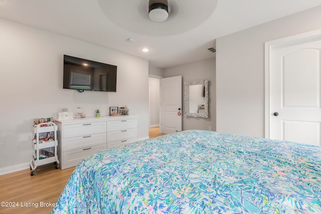 bedroom featuring light hardwood / wood-style floors and ceiling fan