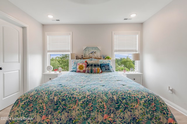 bedroom with light hardwood / wood-style flooring