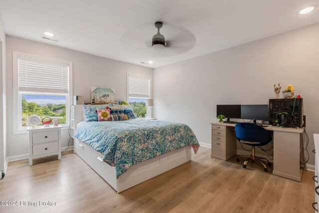 bedroom with ceiling fan and light hardwood / wood-style flooring