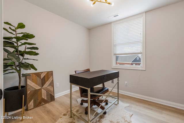 office area with light hardwood / wood-style flooring