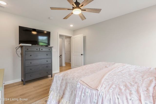 bedroom with ceiling fan and light wood-type flooring