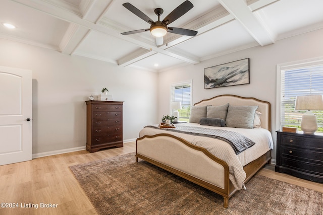 bedroom with ceiling fan, coffered ceiling, light hardwood / wood-style floors, and multiple windows