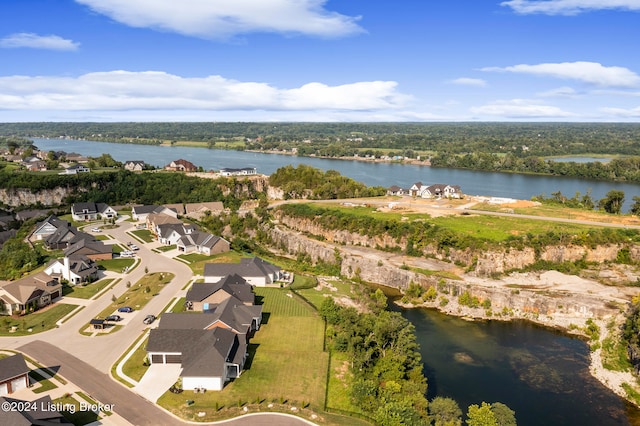 birds eye view of property featuring a water view