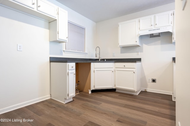 kitchen featuring white cabinetry, sink, and dark hardwood / wood-style flooring