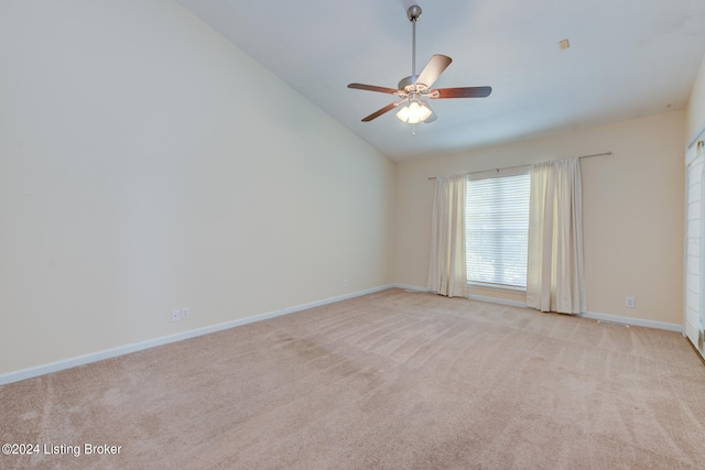 unfurnished room featuring lofted ceiling, light carpet, and ceiling fan