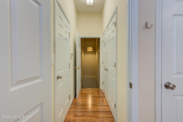 hall with wood-type flooring