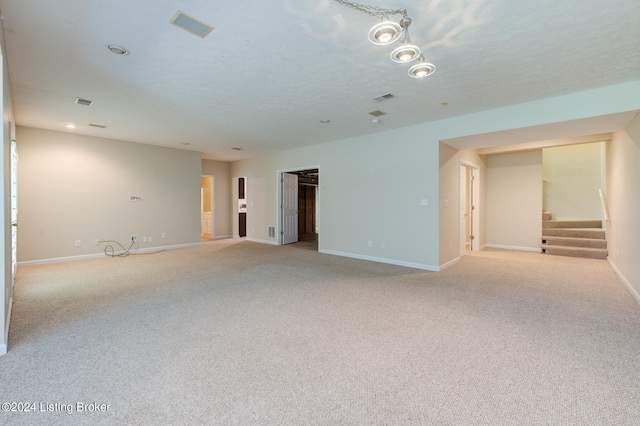 empty room featuring light carpet