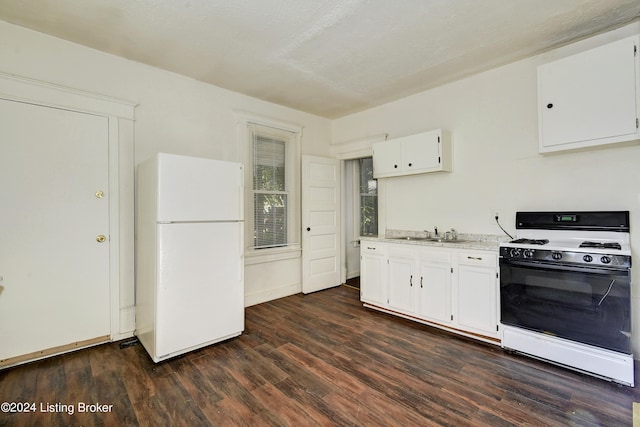 kitchen featuring white cabinetry, white appliances, dark hardwood / wood-style flooring, a textured ceiling, and sink