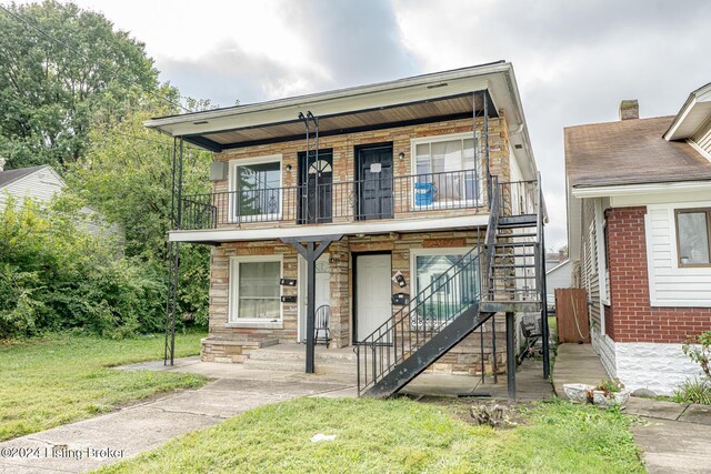 view of front of house featuring a front lawn and a porch