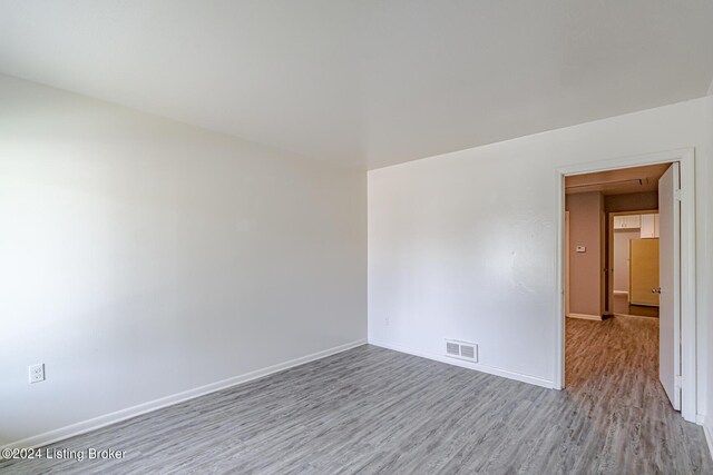 spare room featuring light hardwood / wood-style floors