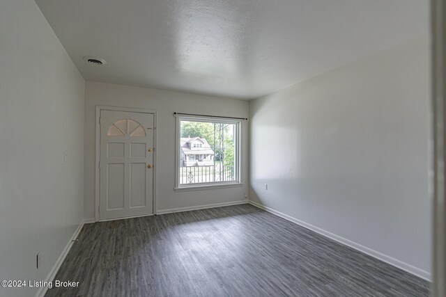 foyer with dark hardwood / wood-style flooring