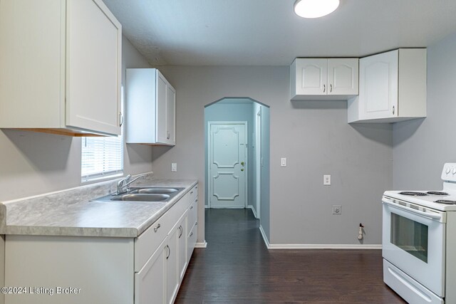 kitchen with white range with electric cooktop, sink, dark hardwood / wood-style flooring, and white cabinetry