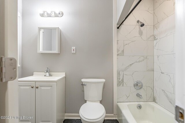 full bathroom with tiled shower / bath combo, vanity, and toilet