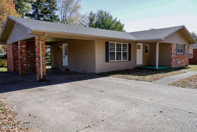 ranch-style house with a carport