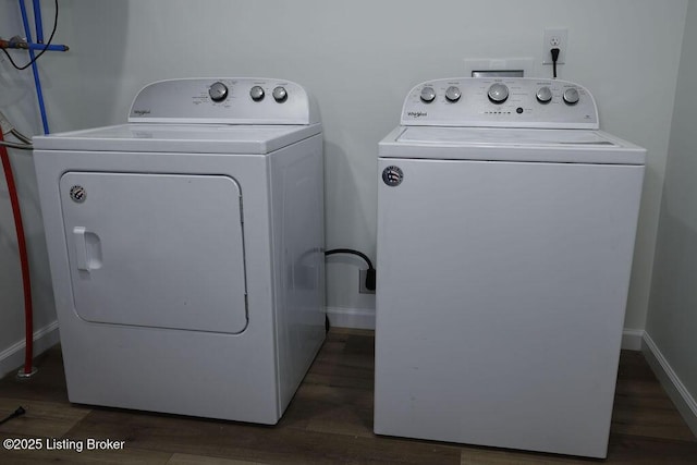 washroom featuring dark hardwood / wood-style floors and separate washer and dryer