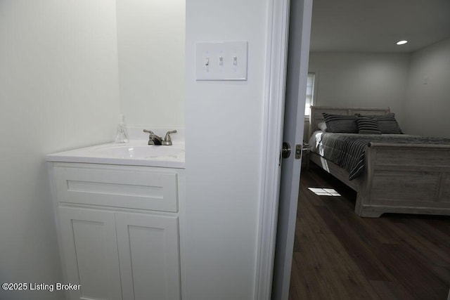 bathroom featuring hardwood / wood-style flooring and vanity