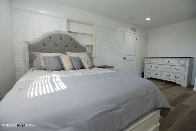 bedroom featuring dark hardwood / wood-style flooring