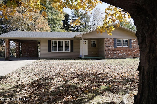 ranch-style home featuring a carport