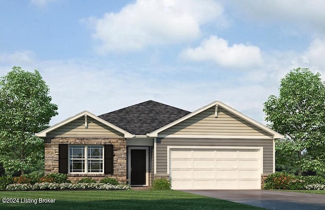 view of front of home with a front yard and a garage