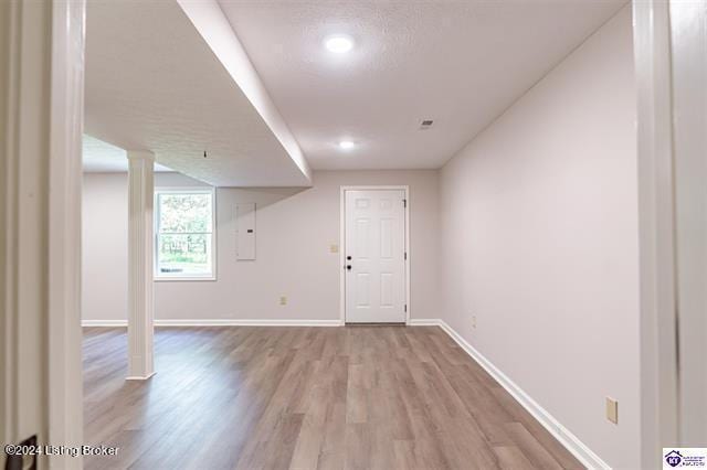 2656 Doe Valley Pkwy, Brandenburg, KY 40108 - basement with baseboards, light wood finished floors, and electric panel