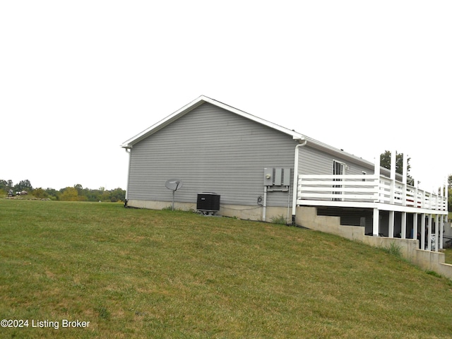 2608 Hickory Ridge Rd, Mount Eden, KY 40046 - view of property exterior featuring a lawn, central AC unit, and a wooden deck