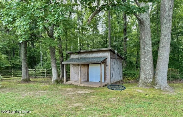 view of outdoor structure with a lawn