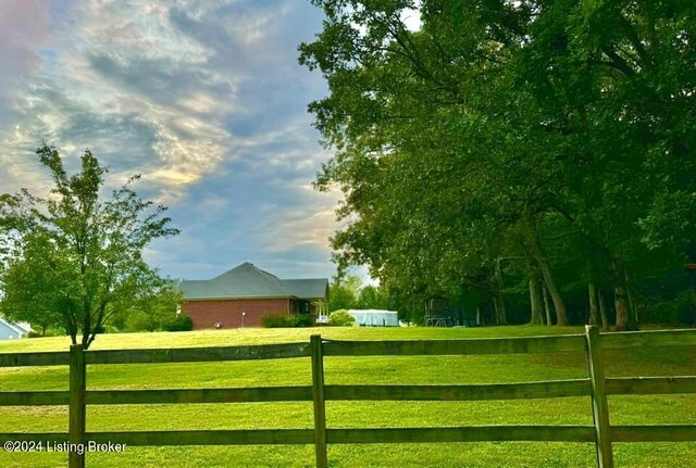 view of gate featuring a lawn