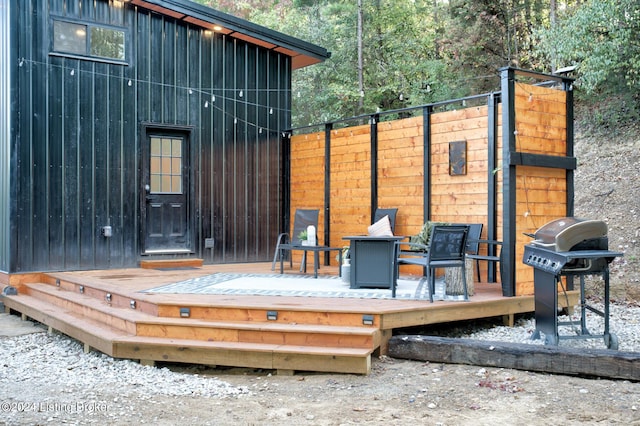 deck with fence and area for grilling
